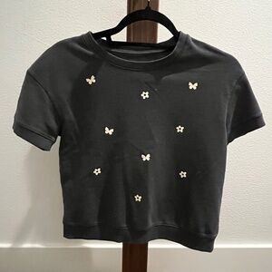 black T-shirt with butterflies and flowers